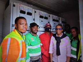 Workers installing MBAK BESS unit in Zambia