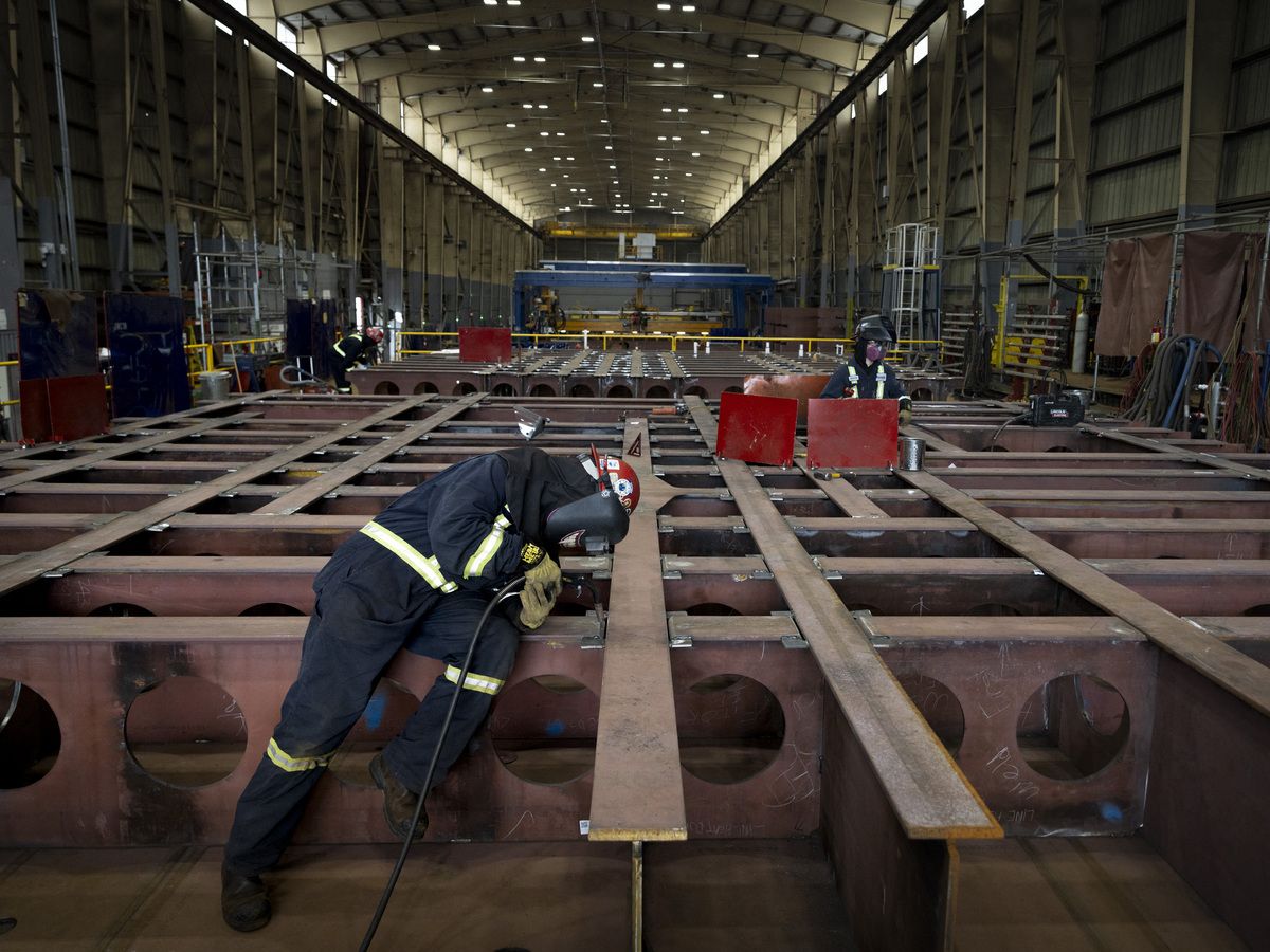  A worker welds the parts of the Polar Icebreaker under construction at Seaspan Shipyards in North Vancouver, British Columbia, on February 13, 2026.