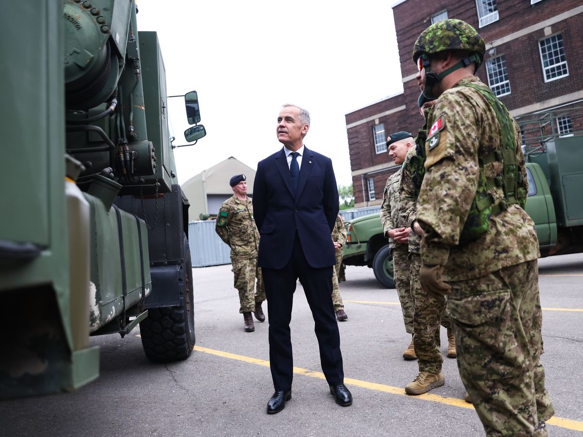  Canadian Prime Minister Mark Carney tours military vehicles and meets with Canadian troops of the 4th Canadian Division as he attends a tour of the Fort York Armoury on June 9, 2025 in Toronto, Canada.