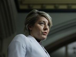 Minister of Industry Mélanie Joly speaks to media before a Liberal caucus meeting on Parliament Hill in Ottawa March 11, 2026.