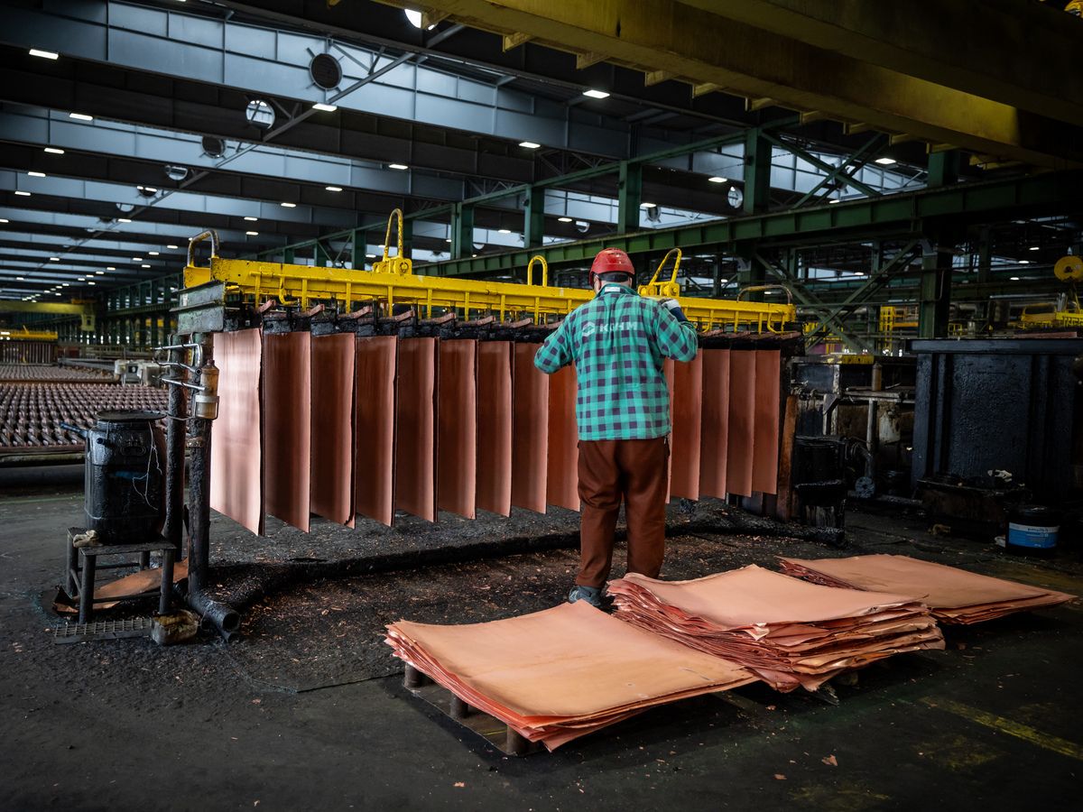 A worker monitors the electrochemical process of extracting pure copper at a smelter in Glogow in southwestern Poland, owned by KGHM the metallurgical giant in the country, on March 24, 2026.