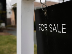 A House For Sale sign is displayed in front of a home in Evanston, Ill., on March 25, 2026.