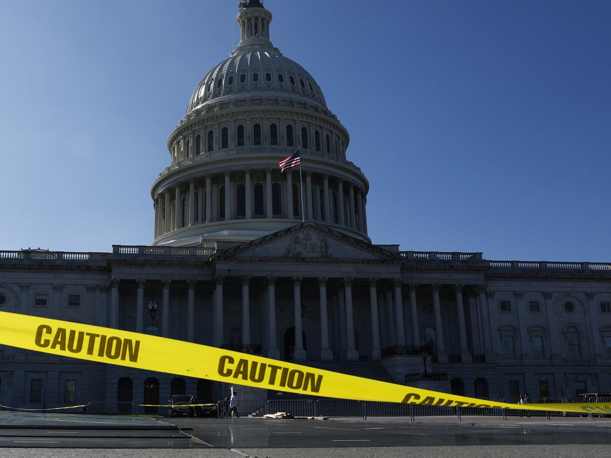 Caution tape blows in the wind on the east front plaza of the U.S. Capitol Building on September 27, 2023 in Washington, DC.