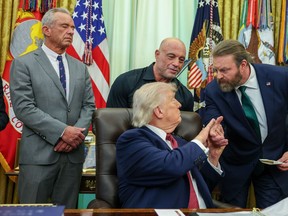 U.S. President Donald Trump greets Bryan Hubbard in the Oval Office after signing an Executive Order April 18, 2026 in Washington, DC.