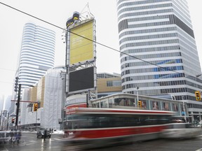 Time exposure of Dundas St. and Yonge St. in Toronto, Ont. with Eaton's Centre in background
