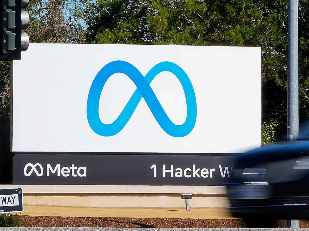 A car passes Facebook's new Meta logo on a sign at the company headquarters on Oct. 28, 2021, in Menlo Park, Calif.