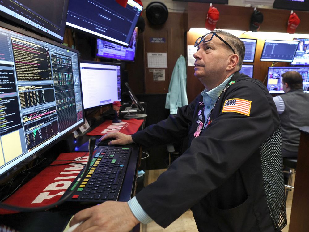 Traders work on the floor of the New York Stock Exchange (NYSE) at the opening bell in New York on April 16, 2026.
