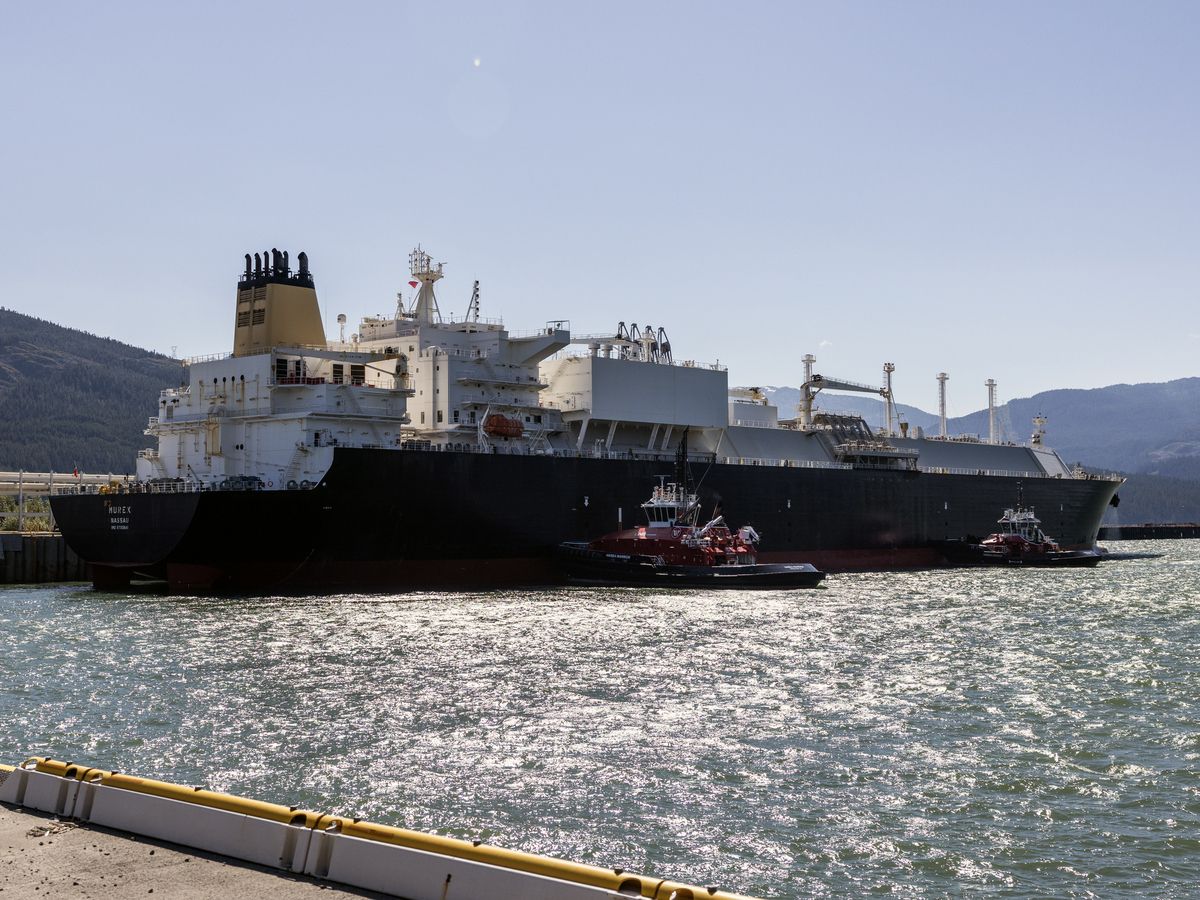 An LNG carrier maneuvers with the help of tugboats in Kitimat. A fleet of tugboats escort LNG carrying ships to and from their berth in Kitimat.