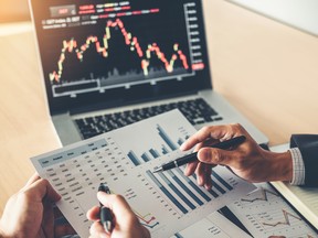 Business Team Investment Entrepreneur Trading discussing and analysis graph stock market trading,stock chart concept getty