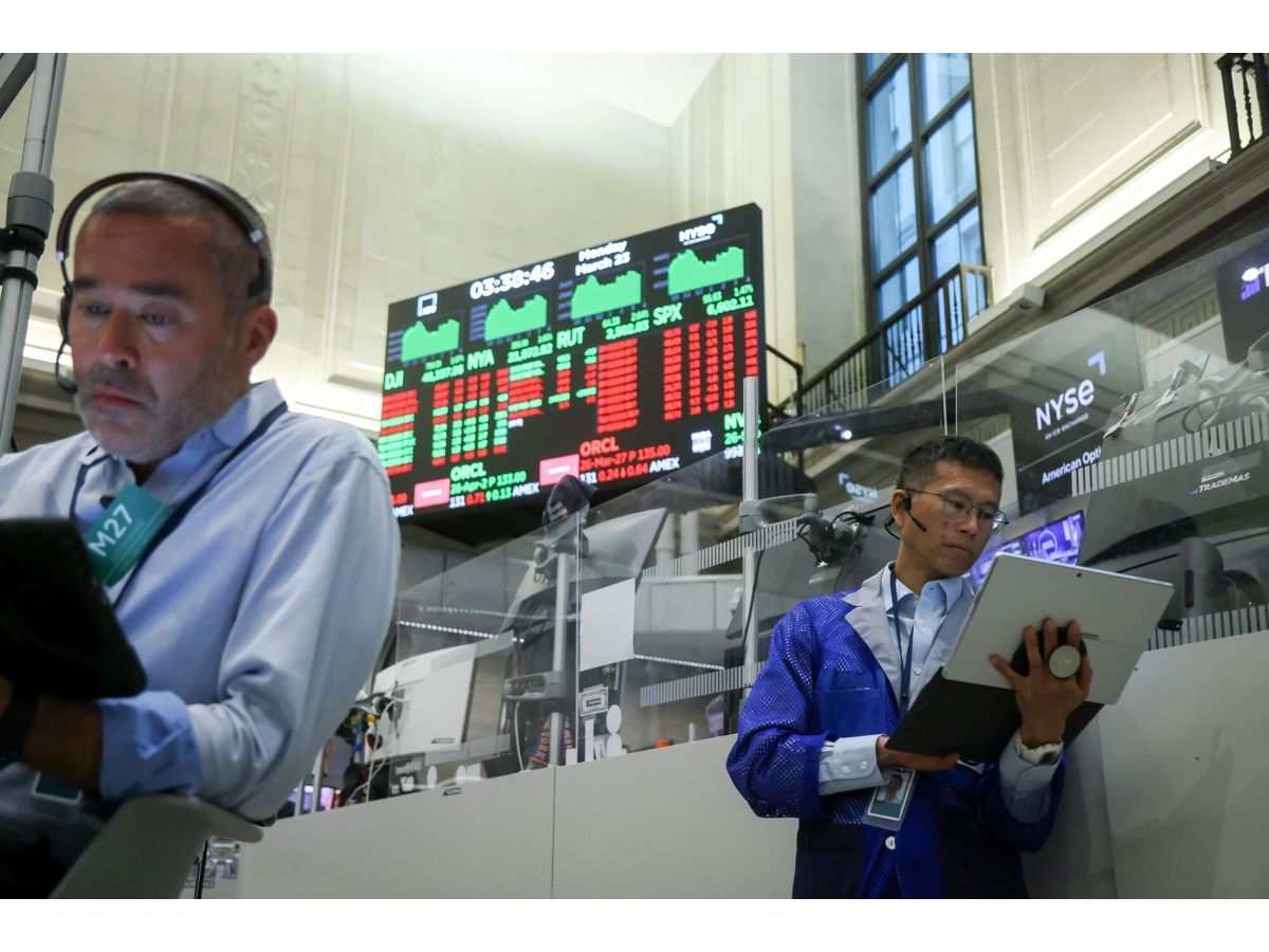 Traders work on the floor of the New York Stock Exchange.