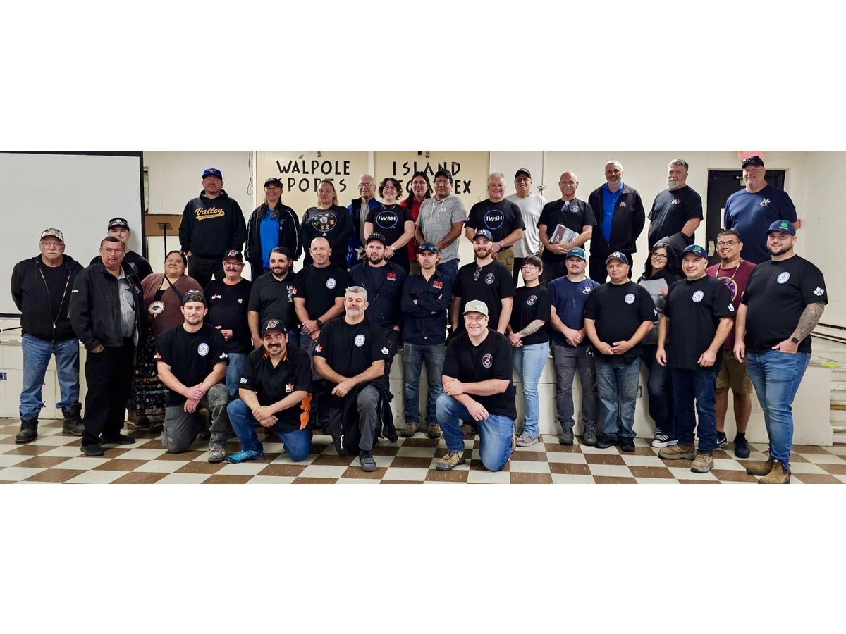 Volunteers, industry professionals, and community members in Walpole Island First Nation support hands-on plumbing training and infrastructure upgrades through a partnership between IWSH and UA Canada, with SCC helping to promote the initiative.