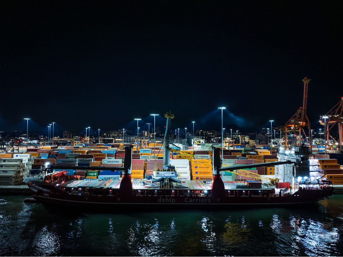 Cargo operations underway at DP World's Vancouver terminal, where a newly delivered mobile harbour crane will support high-frequency short-sea shipping services, improving cargo velocity and regional supply chain connectivity across British Columbia.