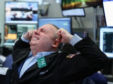 A trader works on the floor of the New York Stock Exchange at the opening bell in New York on March 24.