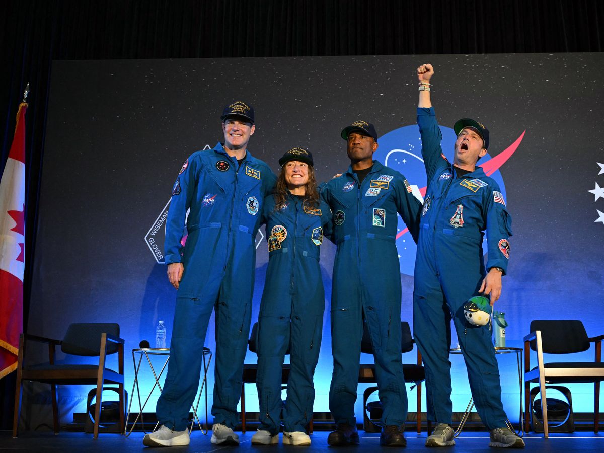 NASA's Artemis II mission astronauts from left to right: Canadian Space Agency's Jeremy Hansen, mission specialist Christina Koch, pilot Victor Glover and commander Reid Wiseman attend a welcoming ceremony at Ellington Field Joint Reserve Base in Houston, Texas, on April 11.