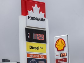 Gas prices are advertised at station signs off the Trans Canada in northwest Calgary on April 15.