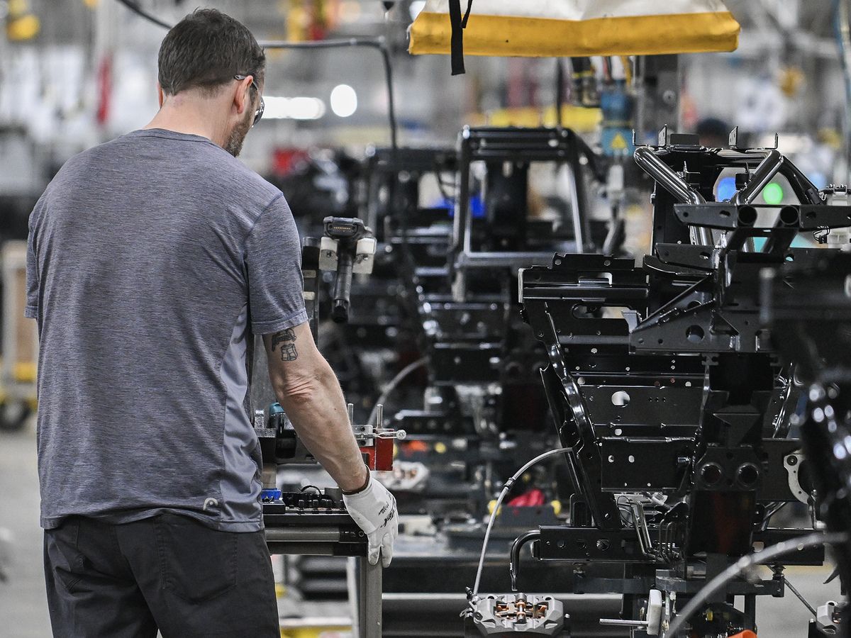 A worker assembles Can-Am 3-Wheel vehicles at a BRP Inc. manufacturing facility in Valcourt, Que.