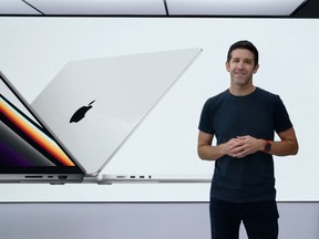 Apple Inc.'s John Ternus introduces the new MacBook Pro during an online event unveiling new products at Apple Park in Cupertino, California on Oct. 18, 2021. Apple's Tim Cook will step down as the California tech giant's chief executive this year, handing the top job to company veteran John Ternus as it navigates a technology landscape being upended by artificial intelligence.