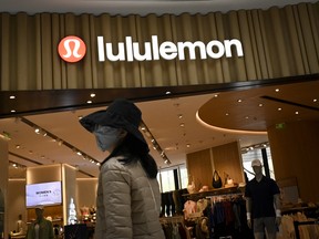 A woman walks past a Lululemon Athletica Inc. store in Beijing, China.
