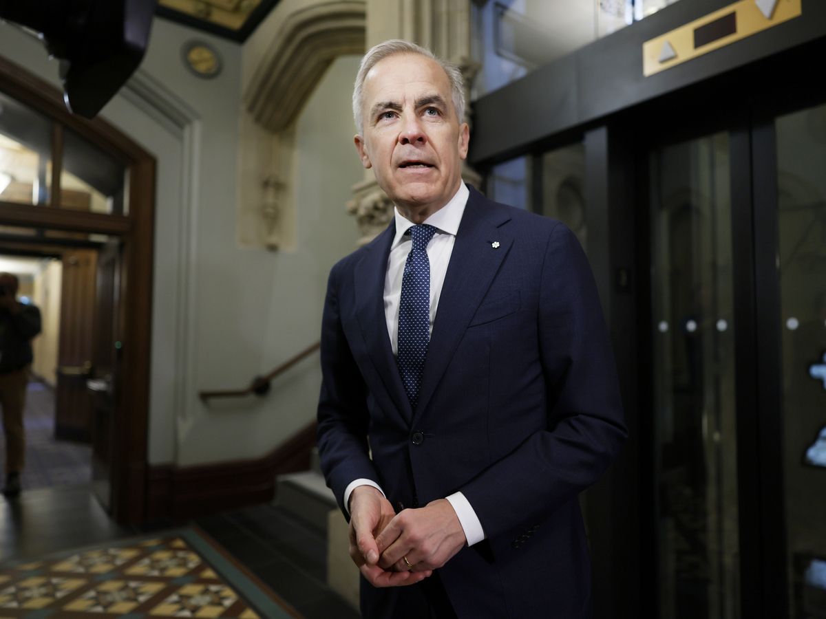 Prime Minister Mark Carney walks to his office for a Cabinet meeting on Parliament Hill in Ottawa on April 28.