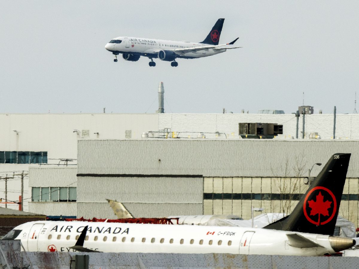 An Air Canada flight lands at Trudeau Airport in Montreal, Que.