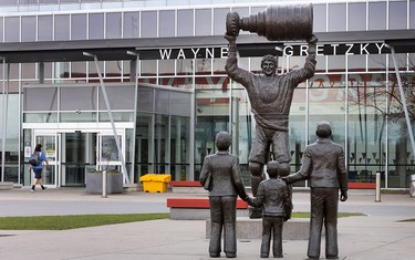 A statue of the Great One and his parents outside Wayne Gretzky Sports Centre in Brantford, Ont.
