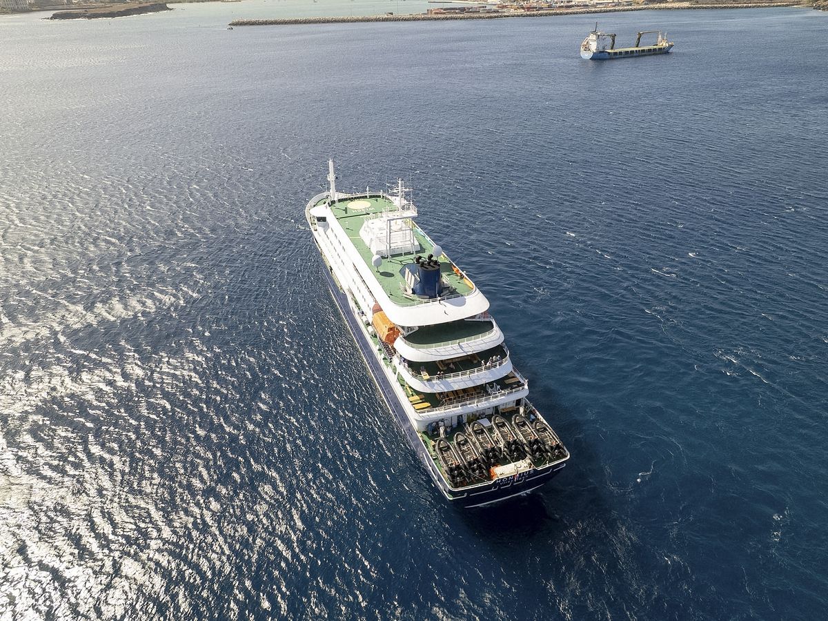 This aerial picture shows a general view of the cruise ship MV Hondius stationary off the port of Praia, the capital of Cape Verde, on May 3, 2026.