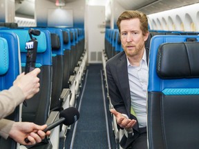 WestJet chief executive Alexis von Hoensbroech answers questions while sat in economy seat aboard a Boeing 787-9 Dreamliner at the company's Calgary hangar on Feb. 17, 2026.