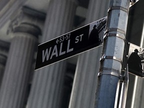 A street sign for Wall Street in the Financial District near the New York Stock Exchange (NYSE) on May 19, 2025, in New York