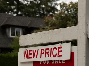 A 'New Price' sign outside a home for sale in Vancouver, British Columbia, Canada, on Wednesday, Oct. 1, 2025.