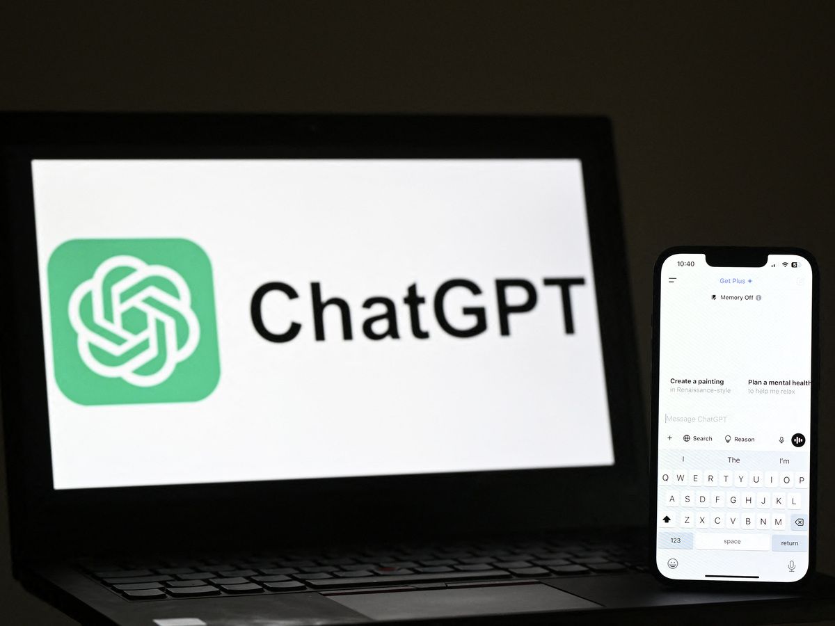 An illustration photograph taken on February 20, 2025 shows ChatGPT app and website are displayed on a phone and laptop screens, in a residential property in Guildford, south of London. The American company OpenAI announced on September 2, 2025,