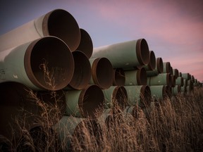 Miles of unused pipe, prepared for the proposed Keystone XL pipeline, sit in a lot on October 14, 2014 outside Gascoyne, North Dakota.