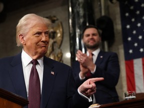 US Vice President JD Vance and Speaker of the House Mike Johnson (R-LA) applaud as US President Donald Trump speaks during an address to a joint session of Congress in the House Chamber of the US Capitol in Washington, DC, on March 4, 2025.