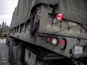A military truck with a Canadian flag is seen during the Canada Day Celebrations in the Old Port in Montreal, Quebec, on July 1, 2025.