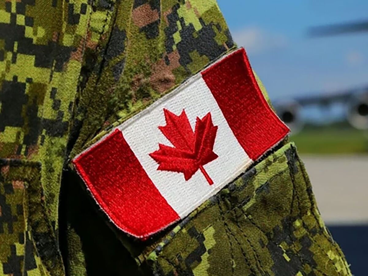 A Canadian Armed Forces member stands near a CC-177 Globemaster III at CFB Trenton, Ont.