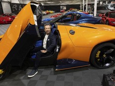 Luc Poirier, a real estate tycoon in Quebec, sits in one of his 35 ferraris at his warehouse in La Prairie, Quebec. His collection is valued at over $90 million.