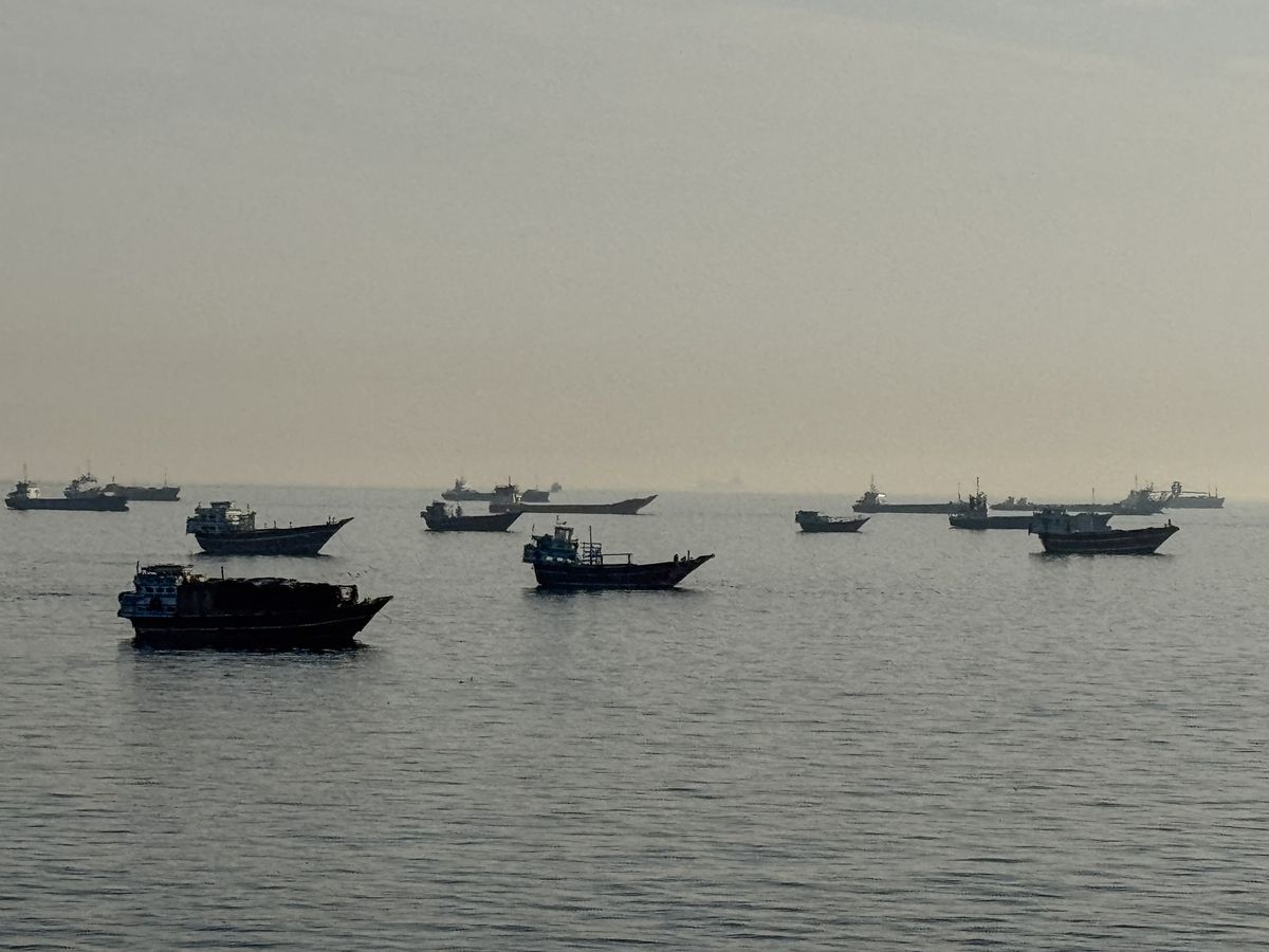 Vessels are seen anchored in the Strait of Hormuz, off the port city of Khasab on Oman's northern Musandam Peninsula on May 17, 2026.