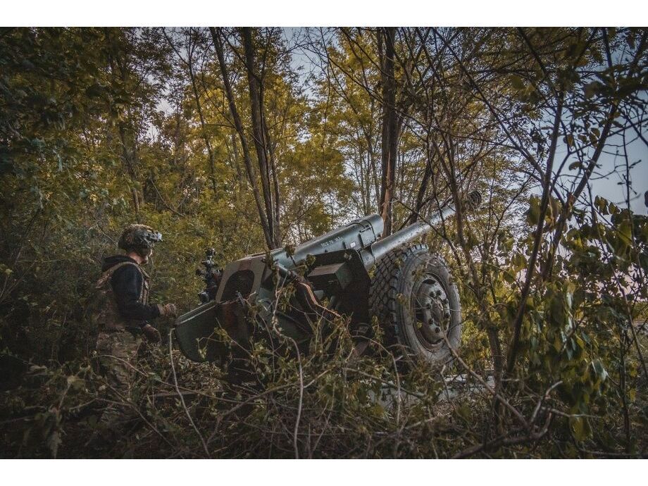 A soldier prepares a cannon to fire from an artillery position in the Sumy region of Ukraine.