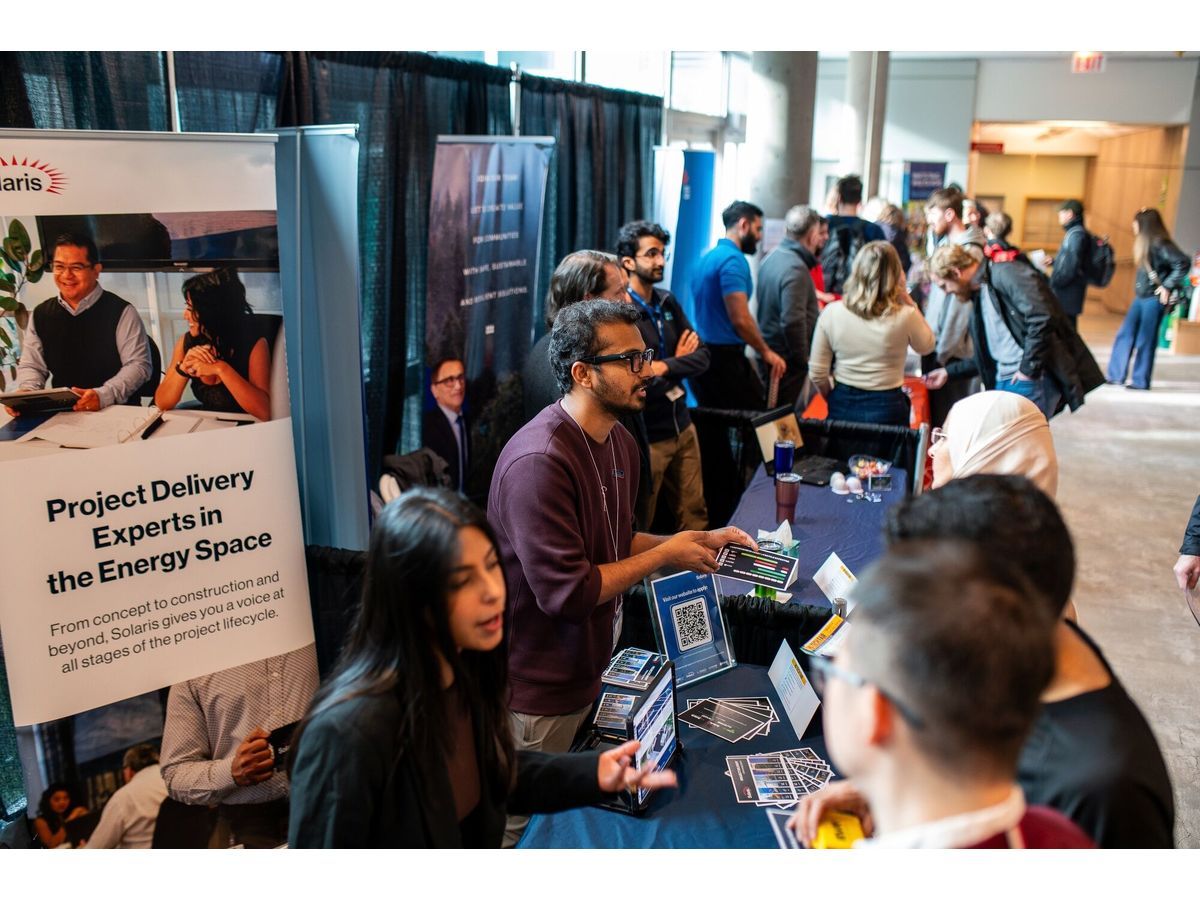 Students speak with representatives during the Hi-Tech Career Fair at the University of Victoria in Victoria, British Columbia. Youth unemployment rose to 14.3% in April.
