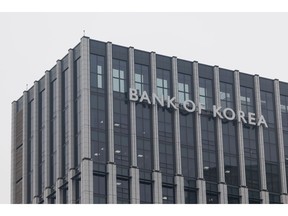 Bank of Korea (BOK) signage displayed atop the central bank's headquarters in Seoul, South Korea, on Wednesday, Feb. 11, 2026. South Korea is likely to roll out around 10 trillion won ($6.8 billion) in fresh fiscal stimulus as early as March to address uneven economic growth, with support expected for sectors including culture and the arts, Citigroup said in a January report.