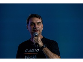 Flavio Bolsonaro, Brazilian presidential candidate, speaks during a campaign launch for Guilherme Derrite, pre-candidate for Senate in Sao Paulo, in Campinas, Sao Paulo state, Brazil, on Friday, May 15, Leaked audio messages linking Flavio Bolsonaro to the man at the center of a multibillion-dollar bank fraud scandal are threatening to torpedo the right-wing senator's campaign before it even gets started.