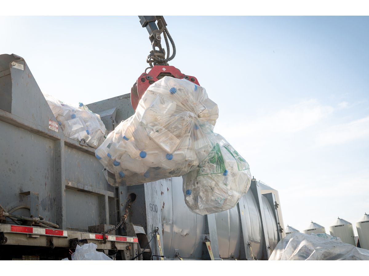 Bags of used, empty pesticide and fertilizer containers are prepared for transportation to recycling processors.