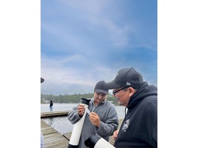 Two Drinking Water Interns work on a water filtration exercise