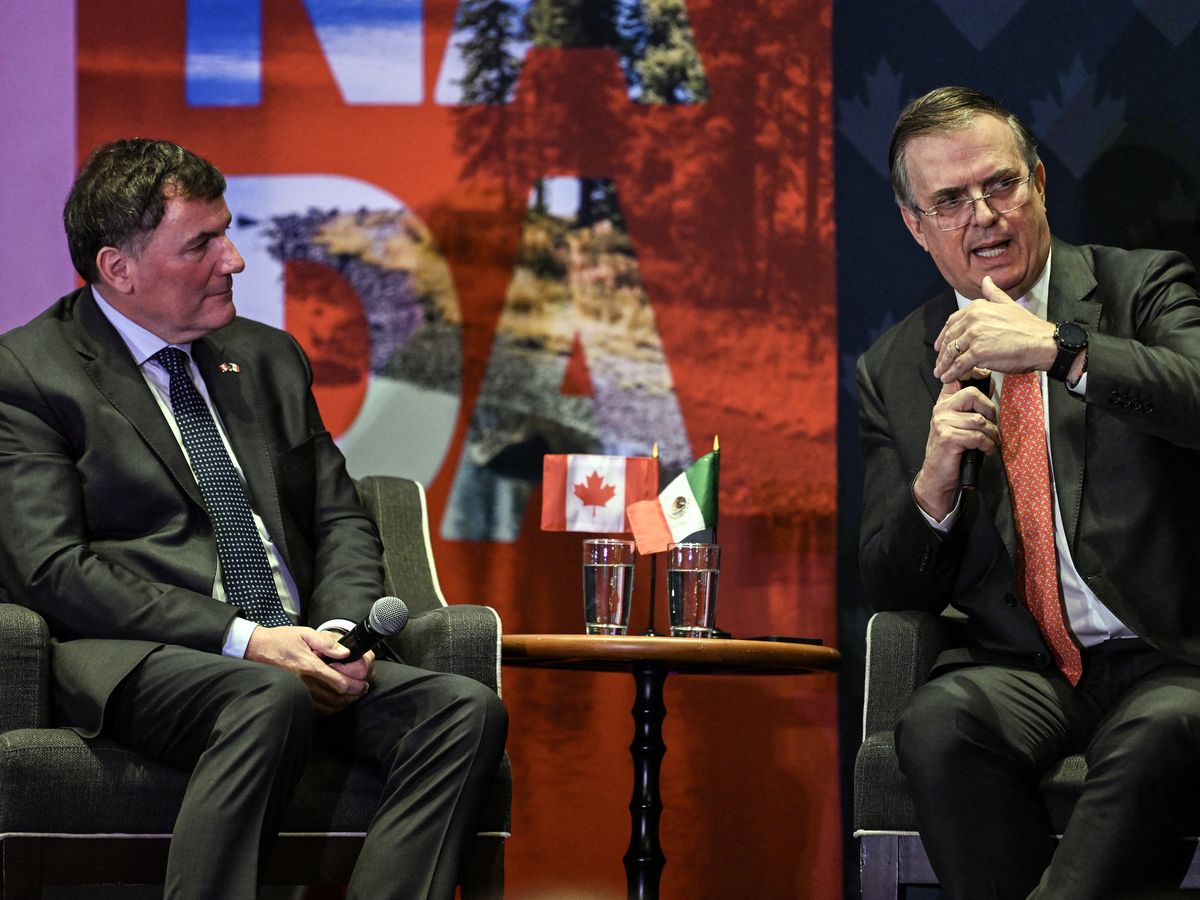 Canada's Minister of Internal Trade, Dominic LeBlanc, left, listens to Mexico's Secretary of Economy, Marcelo Ebrard during a meeting with Canadian business leaders in Mexico City on Feb. 16.
