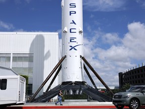 A SpaceX Falcon 9 rocket is displayed at a SpaceX facility in Hawthorne, California.