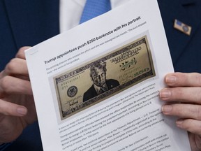 US Secretary of Treasury Scott Bessent shows a proposed $250 bill featuring President Donald Trump during a press briefing in the Brady Briefing Room of the White House in Washington, DC, on May 28, 2026. President Donald Trump could soon appear on a new $250 bill, in the Republican's latest move to shatter US traditions by putting his personal stamp on national institutions. A proposal for the new bill, featuring a glaring Trump, was first reported Thursday by the Washington Post.