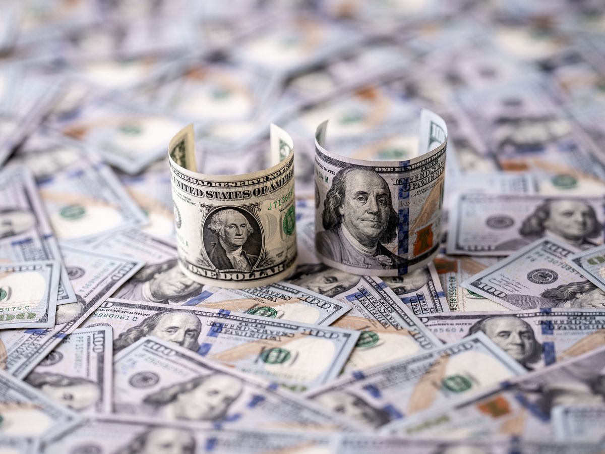 Money background with one-dollar and hundred-dollar bills. US currency and money concept. 1 USD and 100 USD notes. Finance and money concept. American dollars money pattern. Cash and savings getty