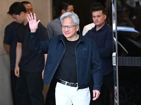 Nvidia CEO Jensen Huang waves to the media as he arrives at Gimpo airport in Seoul on June 5, 2026.
