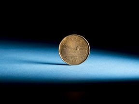 A Canadian one dollar coin, also known as a Loonie, is arranged for a photograph in Toronto, Ontario, Canada, on Wednesday, July 25, 2018