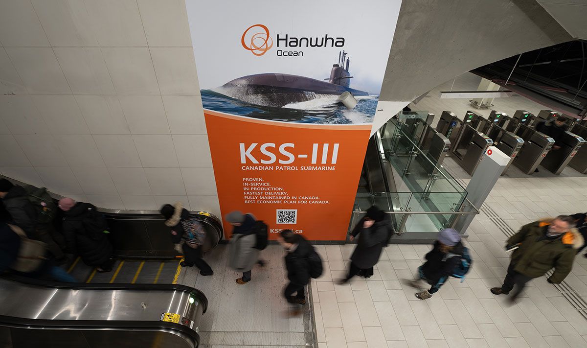 Morning commuters pass by Hanwha Ocean’s advertising in the Parliament LRT station in Ottawa in January. Morning commuters pass by Hanwha Ocean’s advertising in the Parliament LRT station in Ottawa in January.