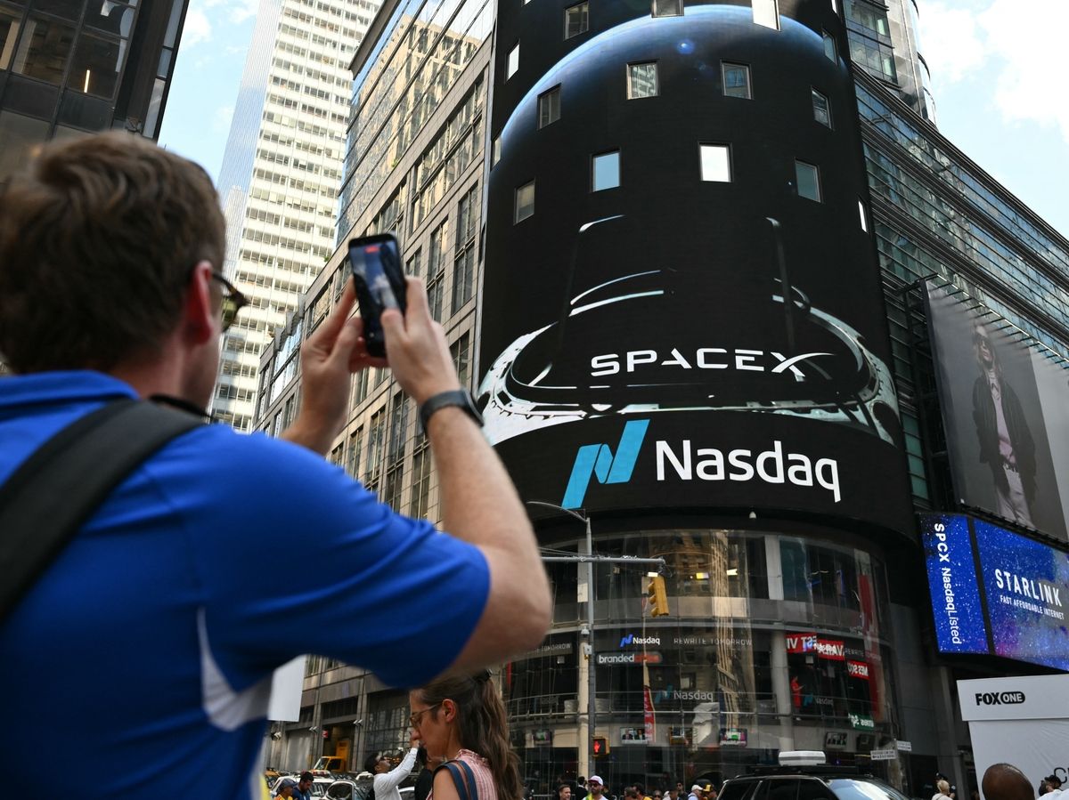 An ad for Elon Musk's Starlink is displayed on a screen at Times Square after the launch of SpaceX's initial public offering (IPO) in New York, on June 12, 2026.
